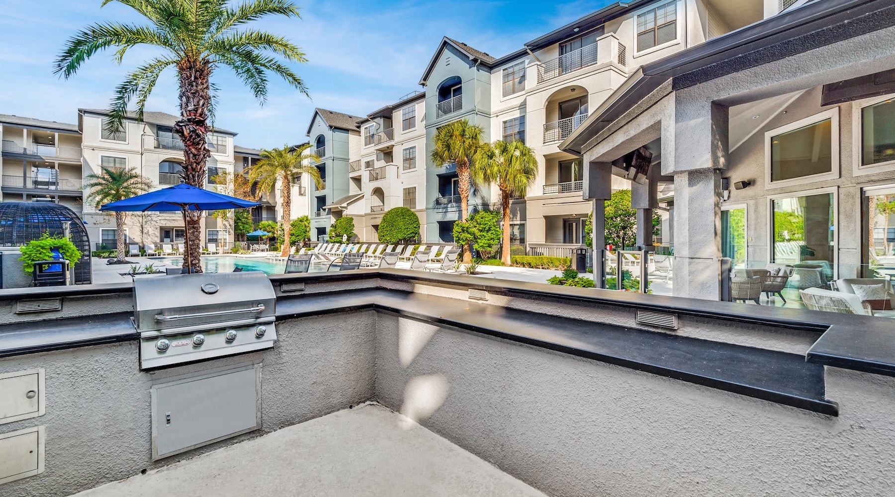 a grill area near a pool