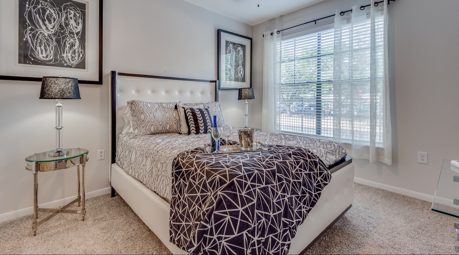 a bedroom with a bed and two nightstands