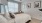 a bedroom with a bed and a fan
