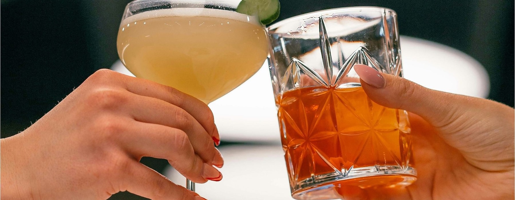 Vibrant community life with a variety of dining options hands holding glasses with cocktails