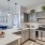 a kitchen with grey cabinets