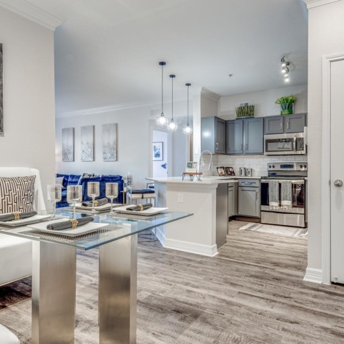 a living room with a table and a booth