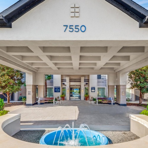 a building with a fountain in front