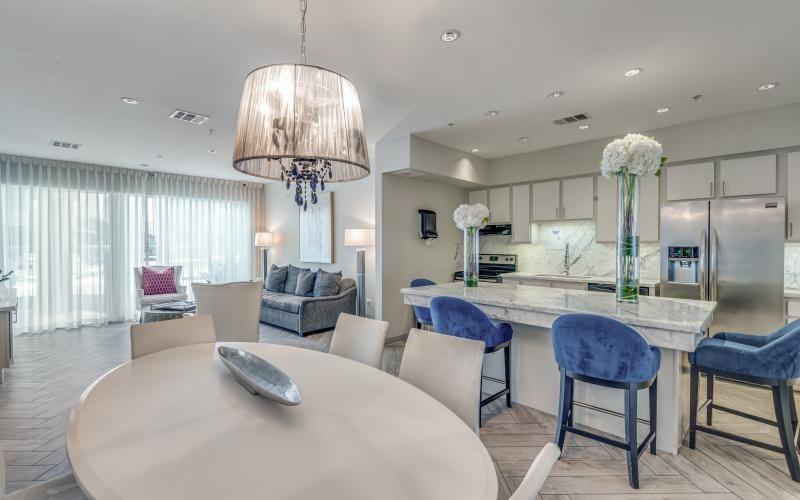 a large kitchen with a dining table