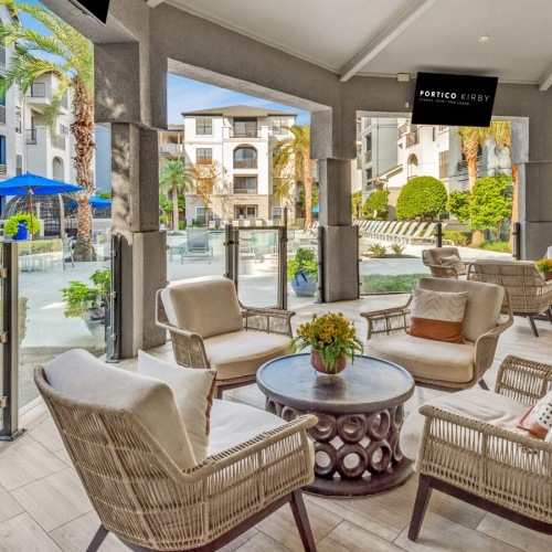 a patio with chairs and tables