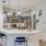 a kitchen with grey cabinets